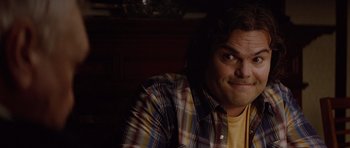 Movie still from “The Big Year” (2011), directed by David Frankel – A person sitting in a room; Close Up shot, Over the shoulder angle