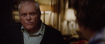 Movie still from “The Big Year” (2011), directed by David Frankel – An older man in a white shirt and a black jacket; Close Up shot, Low angle