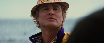 Movie still from “The Big Year” (2011), directed by David Frankel – A person wearing a hat; Close Up shot, Low angle