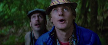 Movie still from “The Big Year” (2011), directed by David Frankel – A man in a hat and a man in a blue jacket looking at something; Close Up shot, Low angle