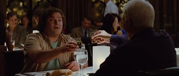 Movie still from “The Big Year” (2011), directed by David Frankel – A group of people sitting at a table drinking wine; Medium shot, Over the shoulder angle