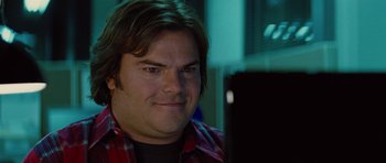 Movie still from “The Big Year” (2011), directed by David Frankel – A person sitting in front of a computer; Close Up shot, Over the shoulder angle