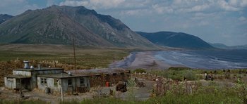 Movie still from “The Big Year” (2011), directed by David Frankel – An old truck is parked near the beach; Extreme Wide shot, High angle
