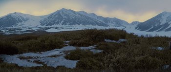 Movie still from “The Big Year” (2011), directed by David Frankel – A mountain range with snow on the top of a hill; Extreme Wide shot, High angle