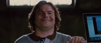 Movie still from “The Big Year” (2011), directed by David Frankel – A person with long brown hair; Close Up shot, Low angle