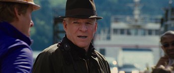 Movie still from “The Big Year” (2011), directed by David Frankel – An older man wearing a hat and a jacket; Close Up shot, Over the shoulder angle