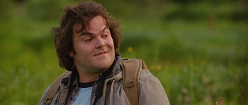 Movie still from “The Big Year” (2011), directed by David Frankel – A person with a backpack; Close Up shot, Over the shoulder angle