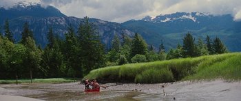 Movie still from “The Big Year” (2011), directed by David Frankel – A group of people in a canoe on a body of water; Extreme Wide shot, High angle