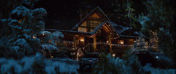 Movie still from “The Big Year” (2011), directed by David Frankel – A house that has a lot of christmas lights on it; Extreme Wide shot, High angle