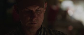 Movie still from “The Biggest Little Farm” (2018), directed by John Chester – A person wearing a hat; Close Up shot, Low angle