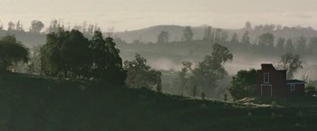 Movie still from “The Biggest Little Farm” (2018), directed by John Chester – A view of a hilly area with trees in the distance; Extreme Wide shot, Low angle
