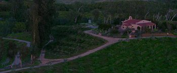 Movie still from “The Biggest Little Farm” (2018), directed by John Chester – An aerial view of a lush green landscape at night; Extreme Wide shot, High angle