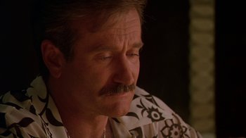 Movie still from “The Birdcage” (1996), directed by Mike Nichols – An older man wearing a hawaiian shirt with a mustache; Close Up shot, Over the shoulder angle