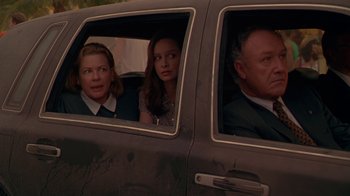 Movie still from “The Birdcage” (1996), directed by Mike Nichols – A group of people in the back of a car looking out of the window; Medium shot, Over the shoulder angle