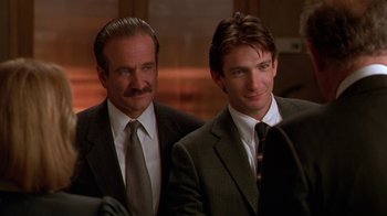 Movie still from “The Birdcage” (1996), directed by Mike Nichols – A couple of men standing next to each other; Close Up shot, Over the shoulder angle