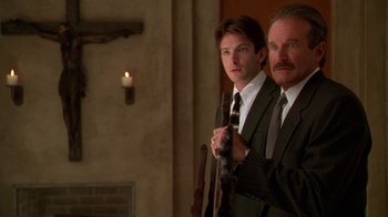 Movie still from “The Birdcage” (1996), directed by Mike Nichols – Two men in suits and ties standing next to each other; Close Up shot, Low angle