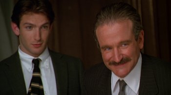 Movie still from “The Birdcage” (1996), directed by Mike Nichols – Two men in suits and ties standing next to each other; Close Up shot, Low angle