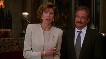 Movie still from “The Birdcage” (1996), directed by Mike Nichols – A man and a woman standing next to each other; Medium shot, Low angle