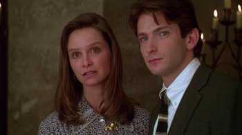 Movie still from “The Birdcage” (1996), directed by Mike Nichols – A man and a woman standing next to each other; Close Up shot, Low angle