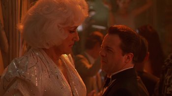 Movie still from “The Birdcage” (1996), directed by Mike Nichols – A man and a woman are looking at one another; Close Up shot, Over the shoulder angle
