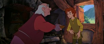 Movie still from “The Black Cauldron” (1985), directed by Ted Berman – An old man and a young boy are in a cave; Medium shot, Over the shoulder angle