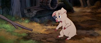 Movie still from “The Black Cauldron” (1985), directed by Ted Berman – A cartoon pig is standing in the dirt; Medium shot, High angle