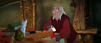 Movie still from “The Black Cauldron” (1985), directed by Ted Berman – An old man sitting at a table with a loaf of bread and an apple in front of him; Medium shot, Over the shoulder angle