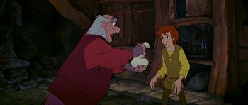 Movie still from “The Black Cauldron” (1985), directed by Ted Berman – An old man and a young boy in a barn; Medium shot, Low angle