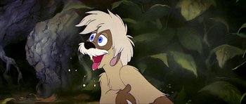Movie still from “The Black Cauldron” (1985), directed by Ted Berman – A dog with a white coat and a brown face; Close Up shot, Low angle