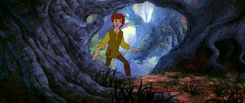 Movie still from “The Black Cauldron” (1985), directed by Ted Berman – A cartoon of a man standing in the woods; Wide shot, High angle
