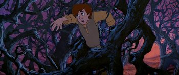 Movie still from “The Black Cauldron” (1985), directed by Ted Berman – A painting of a boy in a tree; Medium shot, High angle