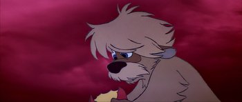 Movie still from “The Black Cauldron” (1985), directed by Ted Berman – A cartoon dog's face with a red sky in the background; Close Up shot, Low angle
