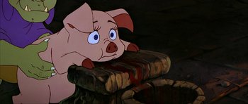 Movie still from “The Black Cauldron” (1985), directed by Ted Berman – A pig sitting on top of a pile of books; Close Up shot, High angle