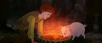 Movie still from “The Black Cauldron” (1985), directed by Ted Berman – A man and a piglet are looking into a pot; Medium shot, High angle