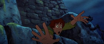Movie still from “The Black Cauldron” (1985), directed by Ted Berman – A cartoon of a boy with his hands in the air; Medium shot, Overhead angle