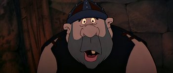 Movie still from “The Black Cauldron” (1985), directed by Ted Berman – An old man with a beard wearing a hat; Close Up shot, Low angle