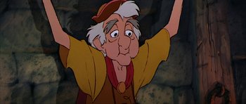Movie still from “The Black Cauldron” (1985), directed by Ted Berman – An old man with white hair wearing a hat; Close Up shot, Low angle