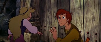 Movie still from “The Black Cauldron” (1985), directed by Ted Berman – A man and a woman are looking at each other; Medium shot, High angle