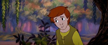 Movie still from “The Black Cauldron” (1985), directed by Ted Berman – A cartoon picture of a young boy in front of a forest; Close Up shot, High angle