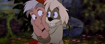 Movie still from “The Black Cauldron” (1985), directed by Ted Berman – An animated character with a person; Close Up shot, Over the shoulder angle