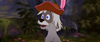 Movie still from “The Black Cauldron” (1985), directed by Ted Berman – A dog wearing a red hat in a forest; Close Up shot, Over the shoulder angle