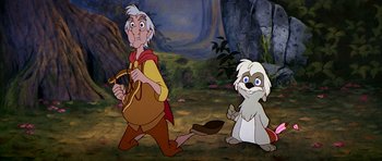 Movie still from “The Black Cauldron” (1985), directed by Ted Berman – A couple of people that are standing in the grass; Medium shot, Low angle