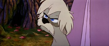 Movie still from “The Black Cauldron” (1985), directed by Ted Berman – An animated bird with white hair and blue eyes; Close Up shot, Over the shoulder angle