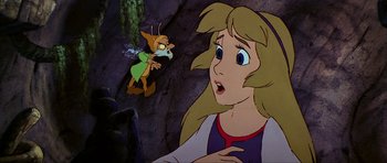 Movie still from “The Black Cauldron” (1985), directed by Ted Berman – A woman is looking at a mouse in a cave; Medium shot, Over the shoulder angle