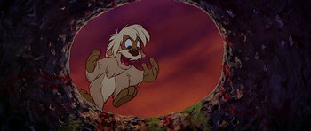 Movie still from “The Black Cauldron” (1985), directed by Ted Berman – A cartoon of a dog jumping in the air in front of a sky background; Wide shot, Overhead angle