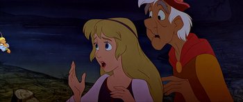 Movie still from “The Black Cauldron” (1985), directed by Ted Berman – A woman with long blonde hair is looking surprised at an old man; Medium shot, Over the shoulder angle