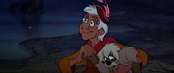 Movie still from “The Black Cauldron” (1985), directed by Ted Berman – An old man and a white dog are sitting together; Close Up shot, Low angle
