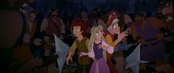 Movie still from “The Black Cauldron” (1985), directed by Ted Berman – A group of people standing in front of a crowd; Medium shot, High angle