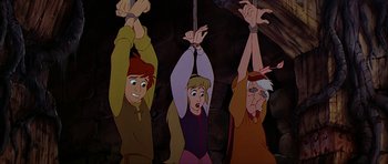 Movie still from “The Black Cauldron” (1985), directed by Ted Berman – A group of three people hanging from a rope; Medium shot, Overhead angle