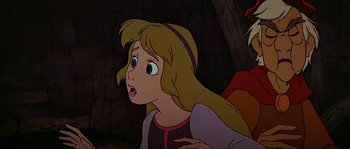 Movie still from “The Black Cauldron” (1985), directed by Ted Berman – A woman with long blonde hair is looking surprised; Close Up shot, Over the shoulder angle